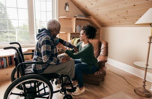 Granddaughter helping to measure blood pressure
